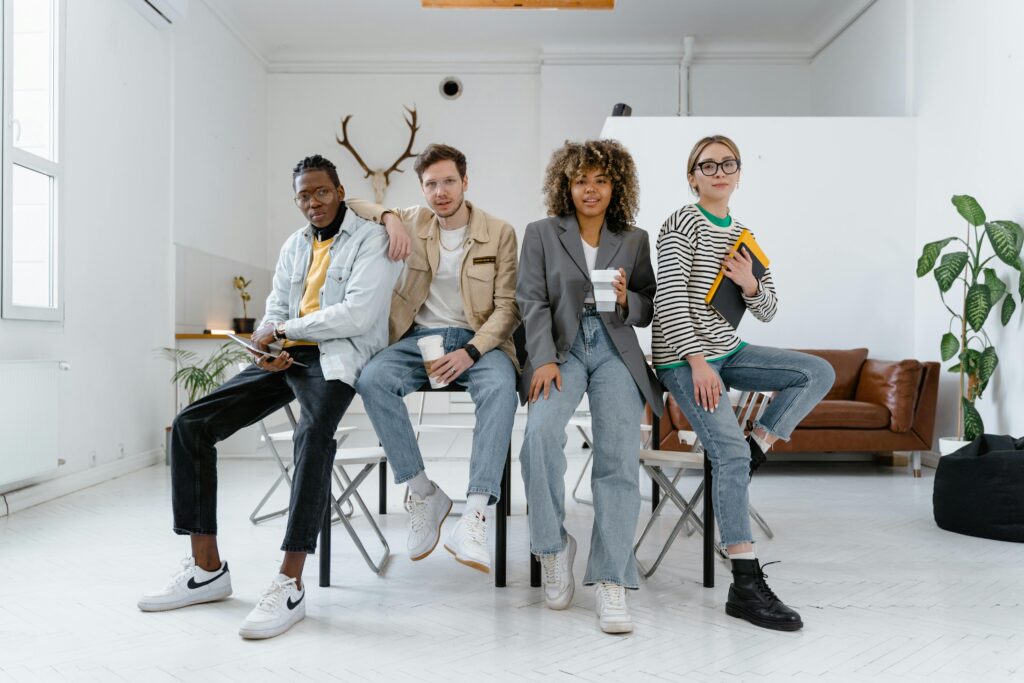 pexels-photo-7550397-7550397 A multicultural group of young professionals in a modern office setting, showcasing teamwork and creativity.